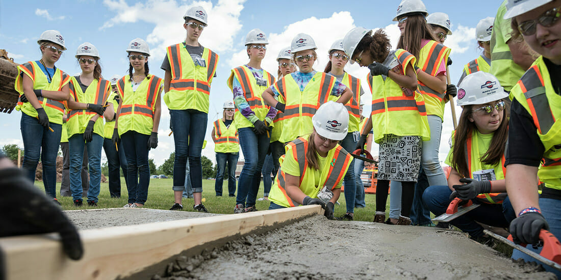 Construction has long been a male-dominated industry—but a big shift is underway. Courtesy Miron Construction. Girls learning about being women in construction at Miron Construction event